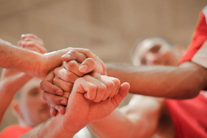 Basketball-team-stacking-hands-together-3755440_edited