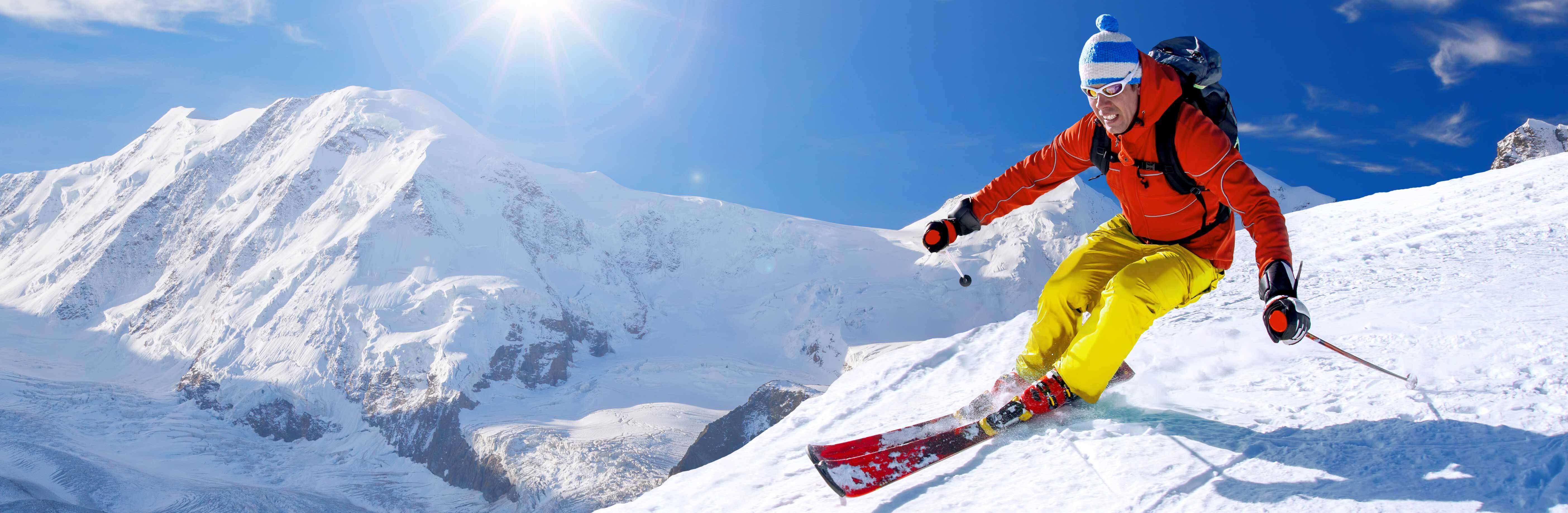 Skier-skiing-downhill-against-matterhorn-peak-in-switzerland-598215726_big_5616x3744